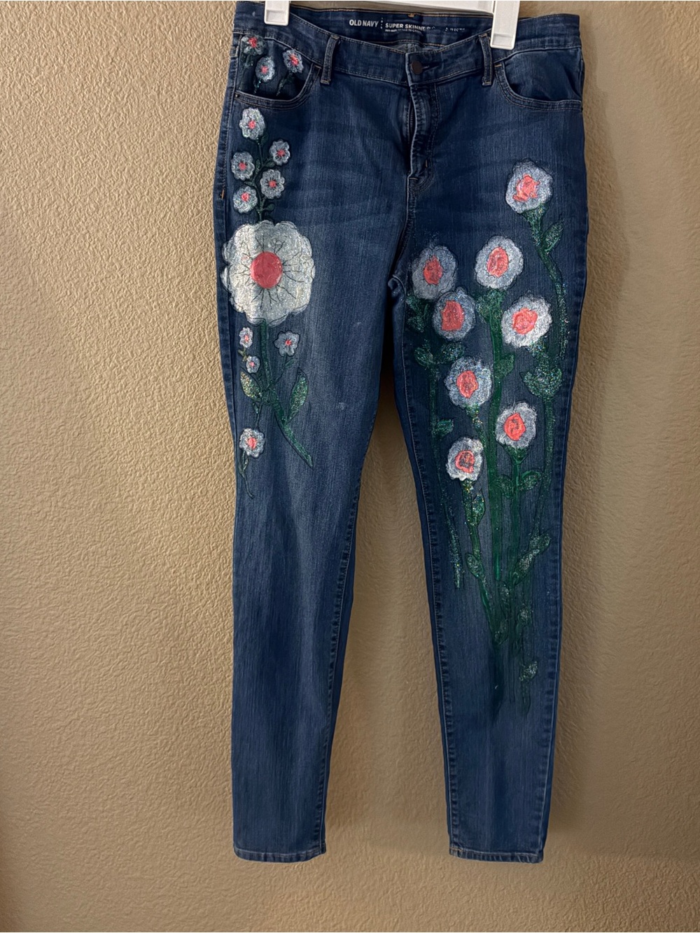 Old Navy Blue Skinny Jeans with Hand-Painted White and Pink Flowers